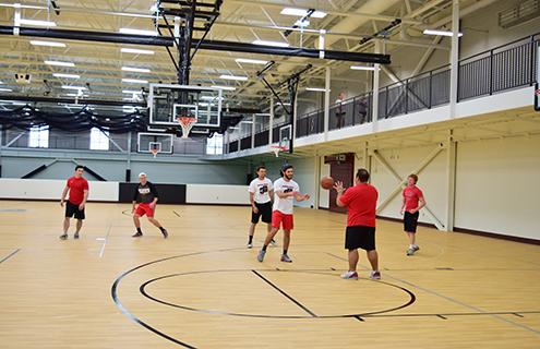 Playing basketball in the rec-center gym
